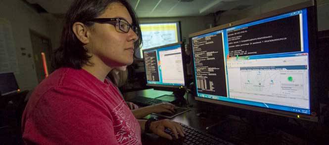 Information technology programs - female student at a computer workstation